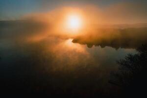 Misty dawn on the lake.Dawn in Europe on a beautiful lake.Belarus photo