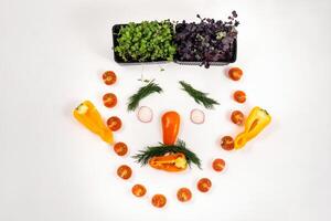 A person's face made of vegetables on a white background photo