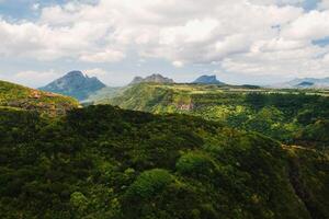 Mountain Landscape of the gorge on the island of Mauritius, Green mountains of the jungle of Mauritius photo