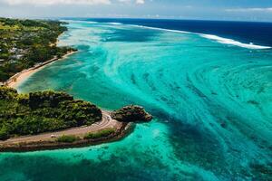 Maconde view point.Monument to captain Matthew Flinders in Mauritius. An unusual road to the Islands of Mauritius. Coral reef in the Indian ocean photo