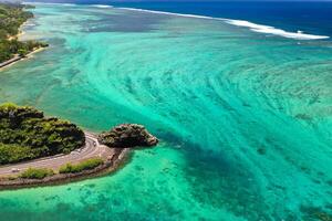 Maconde view point.Monument to captain Matthew Flinders in Mauritius. An unusual road to the Islands of Mauritius. Coral reef in the Indian ocean photo