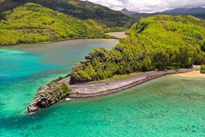 Maconde view point.Monument to captain Matthew Flinders in Mauritius. An unusual road to the Islands of Mauritius. Coral reef in the Indian ocean photo