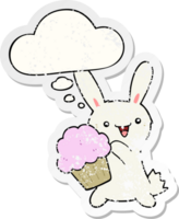cute cartoon rabbit with muffin and thought bubble as a distressed worn sticker png
