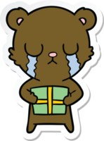 sticker of a crying cartoon bear with present png