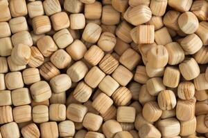 Lots of small wooden cubes. Background of wooden cubes photo