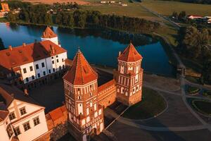 Mir castle with spires near the lake top view in Belarus near the city of Mir photo