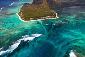 View from the height of the island of Mauritius in the Indian Ocean and the beach of Le Morne-Brabant photo