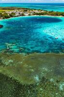 Aerial photography of the East coast of the island of Mauritius. Beautiful lagoon of the island of Mauritius, taken from above.Indian ocean coral reef photo