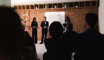 Multiracial business people working inside conference room - Team of diverse creative entrepreneurs doing meeting work photo