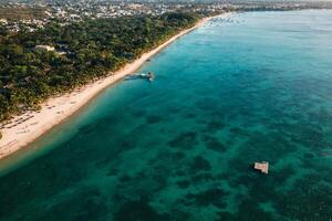 On the beautiful beach of the island of Mauritius along the coast. Shooting from a bird's eye view of the island of Mauritius. photo