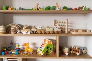 A shelf with children's wooden toys in the children's room. Children's concept photo