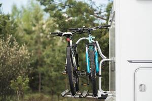 Bicycles are mounted on the motorhome. The concept of travel photo