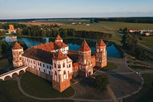 Mir castle with spires near the lake top view in Belarus near the city of Mir photo