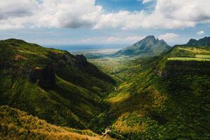 Mountain Landscape of the gorge on the island of Mauritius, Green mountains of the jungle of Mauritius photo