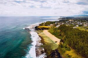 Aerial view of the cliffs of the spectacular Gris Gris Beach, in southern Mauritius. Here, is the strong waves of the Indian Ocean crashing towards the cliffs. the swimming is prohibited here. photo