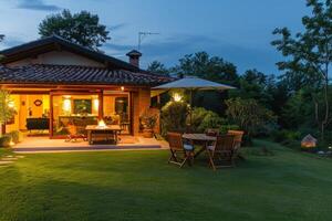 AI generated Luxury country house with evening lighting after sunset photo