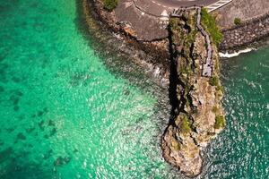 Maconde view point.Monument to captain Matthew Flinders in Mauritius. An unusual road to the Islands of Mauritius. Coral reef in the Indian ocean photo