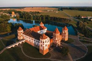 Mir castle with spires near the lake top view in Belarus near the city of Mir photo