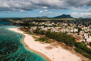 On the beautiful beach of the island of Mauritius along the coast. Shooting from a bird's eye view of the island of Mauritius. photo