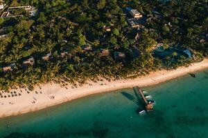 On the beautiful beach of the island of Mauritius along the coast. Shooting from a bird's eye view of the island of Mauritius. photo