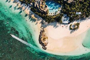 Aerial picture of the east coast of Mauritius Island. Flying above the turquoise lagoon of Mauritius in the region of Belle Mare. photo