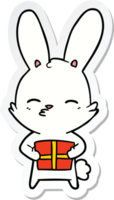 autocollant d'un dessin animé de lapin curieux avec présent png