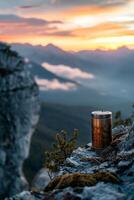 ai generado un al aire libre termo matraz soportes en un rock a puesta de sol foto