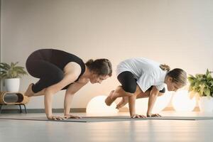 Mom and teenage daughter do gymnastics together in the fitness room. A woman and a girl train in the gym photo