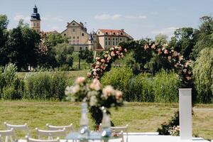 Wedding ceremony on the street on the green lawn near the Nesvizh Castle.Belarus photo