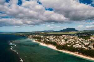 On the beautiful beach of the island of Mauritius along the coast. Shooting from a bird's eye view of the island of Mauritius. photo