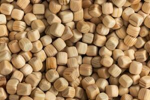 Lots of small wooden cubes. Background of wooden cubes photo