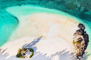 Aerial picture of the east coast of Mauritius Island. Flying above the turquoise lagoon of Mauritius in the region of Belle Mare. photo