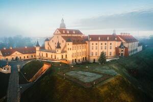 Nesvizh castle is a residential castle of the Radziwill family in Nesvizh, Belarus, with a beautiful view from above at dawn photo