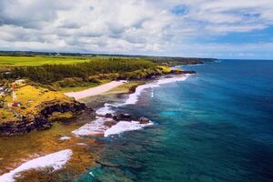 Aerial view of the cliffs of the spectacular Gris Gris Beach, in southern Mauritius. Here, is the strong waves of the Indian Ocean crashing towards the cliffs. the swimming is prohibited here. photo