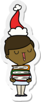 hand drawn sticker cartoon of a happy boy with stack of books wearing santa hat png