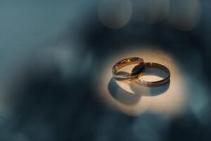 Designer wedding rings lying on the surface. Two wedding rings photo