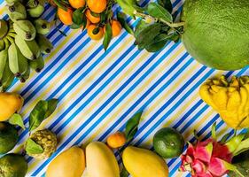 Tropical Fruit Assortment Flat Lay With Copy Space photo