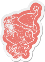 cartoon distressed sticker of a happy cat wearing santa hat png