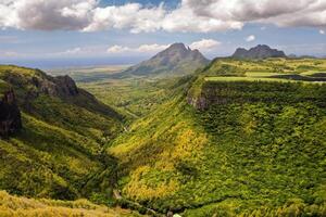 Mountain Landscape of the gorge on the island of Mauritius, Green mountains of the jungle of Mauritius photo