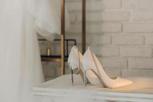 White summer women's shoes for the wedding. Festive high-heeled shoes photo