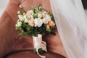 The bride's wedding bouquet of fresh rose flowers. Wedding details photo