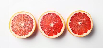 AI generated Three fresh grapefruit slices arranged in a line on a white background, with ample empty space for text photo