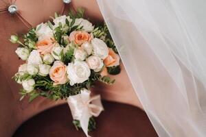 The bride's wedding bouquet of fresh rose flowers. Wedding details photo