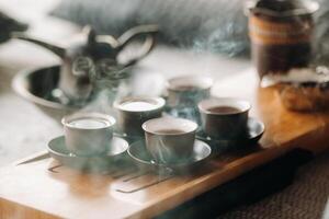 Preparing for a tea ceremony with a large company photo