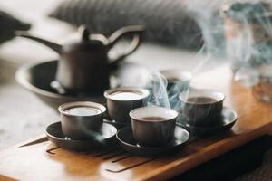 Preparing for a tea ceremony with a large company photo