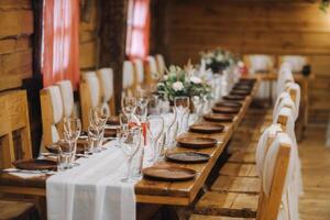 Beautiful table setting with floral decor for the holiday. Wedding decor photo