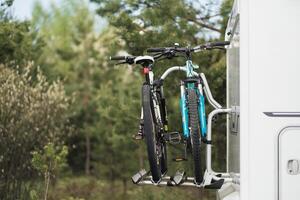 Bicycles are mounted on the motorhome. The concept of travel photo