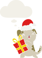 schattige cartoon puppy met kerstcadeau en hoed en gedachte bel in retro stijl png