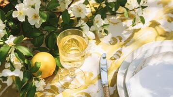 AI generated Wedding or formal dinner holiday celebration tablescape with lemons and flowers in the English countryside garden lemon tree, home styling photo