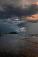 Dark clouds over the beach of Bertioga, Sao Paulo, Brazil. photo